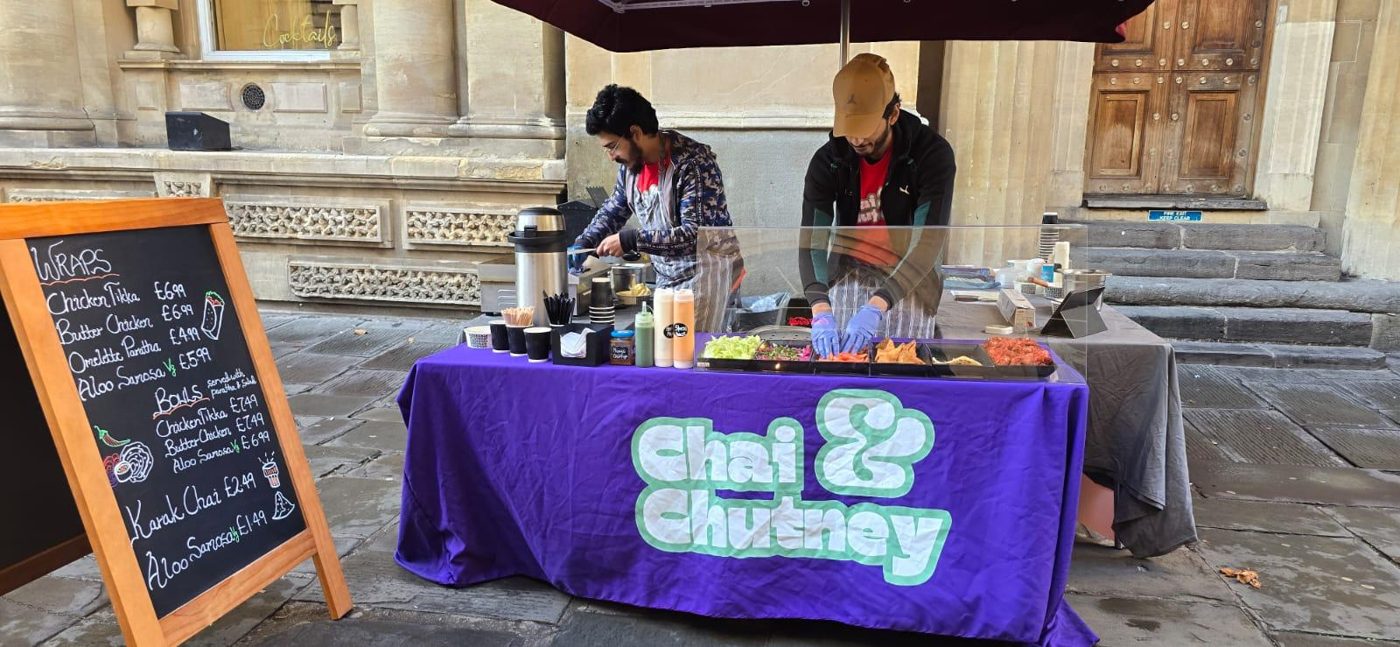 Imran and Ahmed serving at their Chai & Chutney market stall